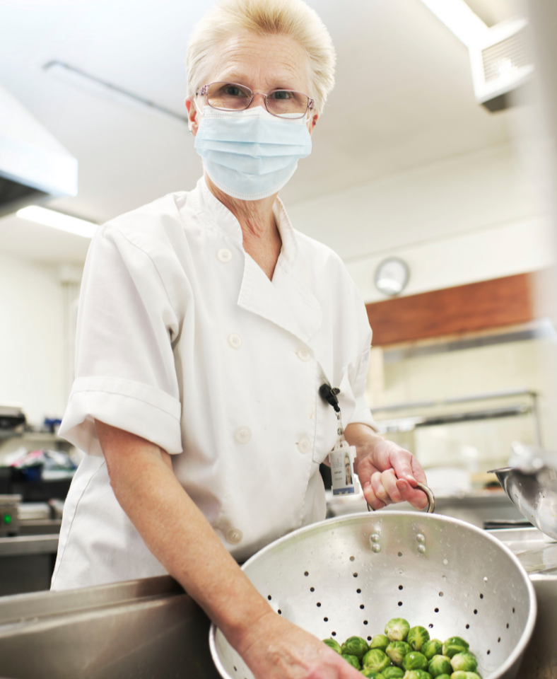 Debbie Spratt in the kitchen with sprouts