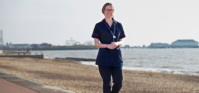 Becky Gatt, clinical nurse specialist standing on seafront at Martello Bay, Clacton-on-Sea  