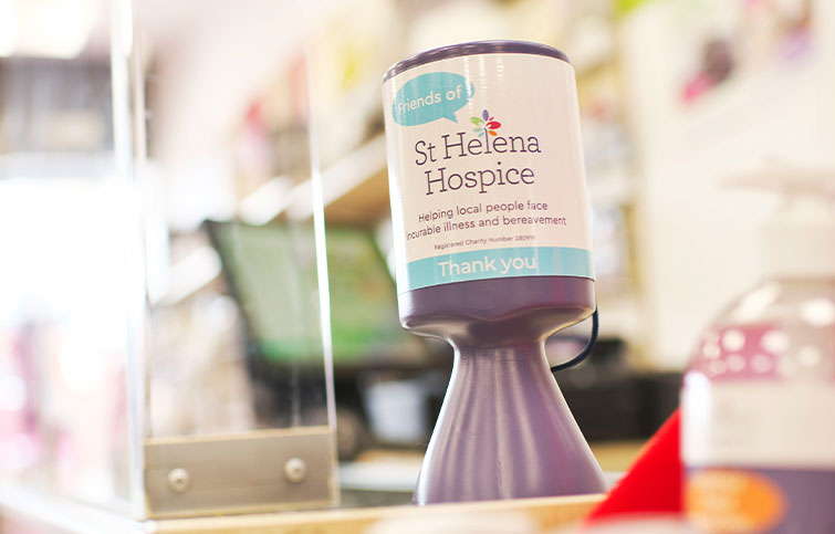 A St Helena Hospice donation pot.